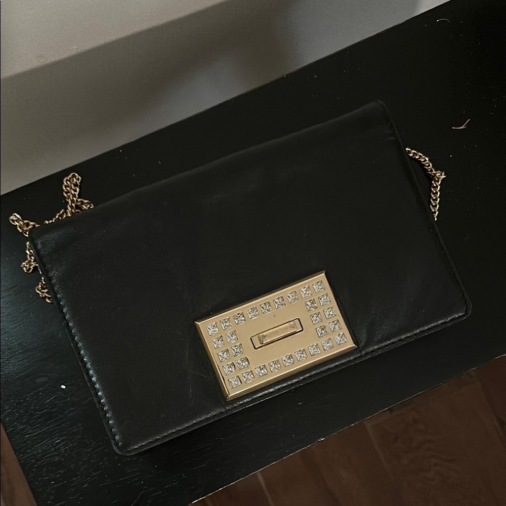 Michael Kors Black and Gold Clutch with Sleek Design